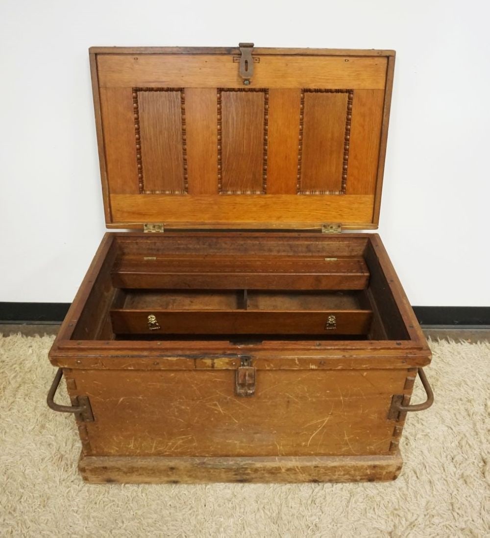 ANTIQUE WOOD TOOL CHEST: ANTIQUE WOOD TOOL CHEST W/UNUSUAL EXTENDED DOVETAILED CORNERS & IRON BAR HANDLED SIDES W/ORNATE INTERIOR, APPROXIMATELY 39 N X 22 IN X 21 IN HIGH