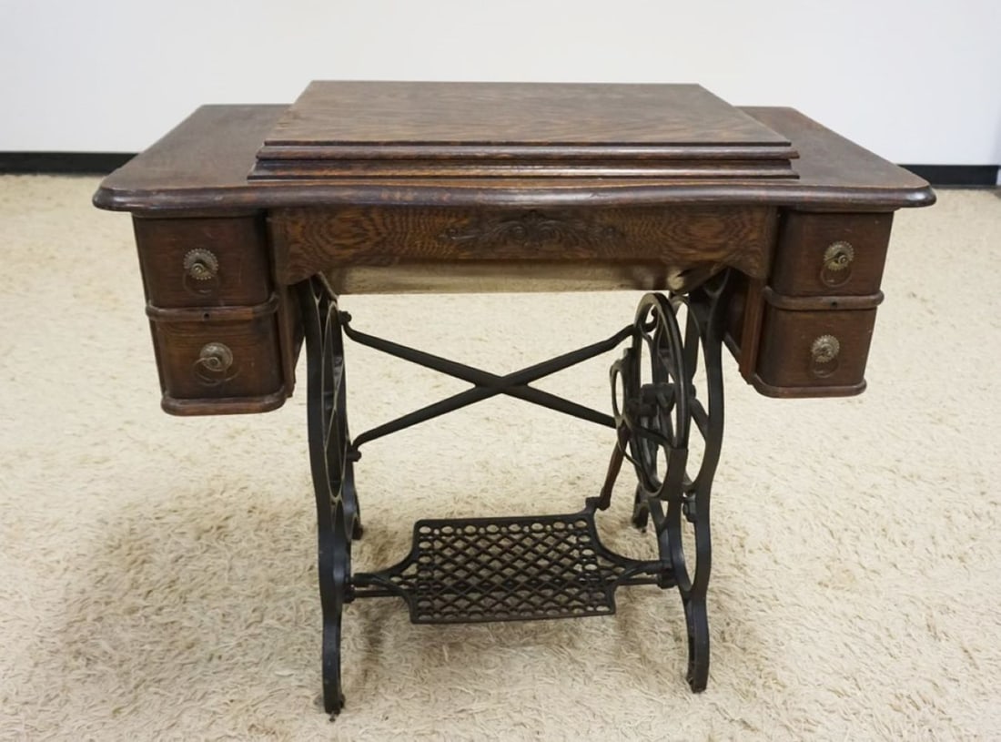 UNIQUE OAK TREADLE SEWING MACHINE: UNIQUE OAK TREADLE SEWING MACHINE, APPROXIMATELY 34 IN X 18 IN X 31 IN