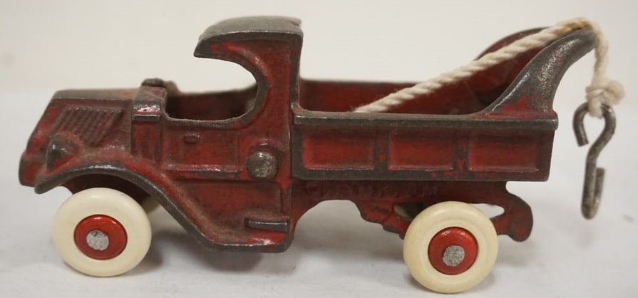 ANTIQUE CAST IRON TOY: ANTIQUE CAST IRON TOY *CHAMPION*TOW TRUCK, APPROXIMATELY 5 IN X 2 IN H
