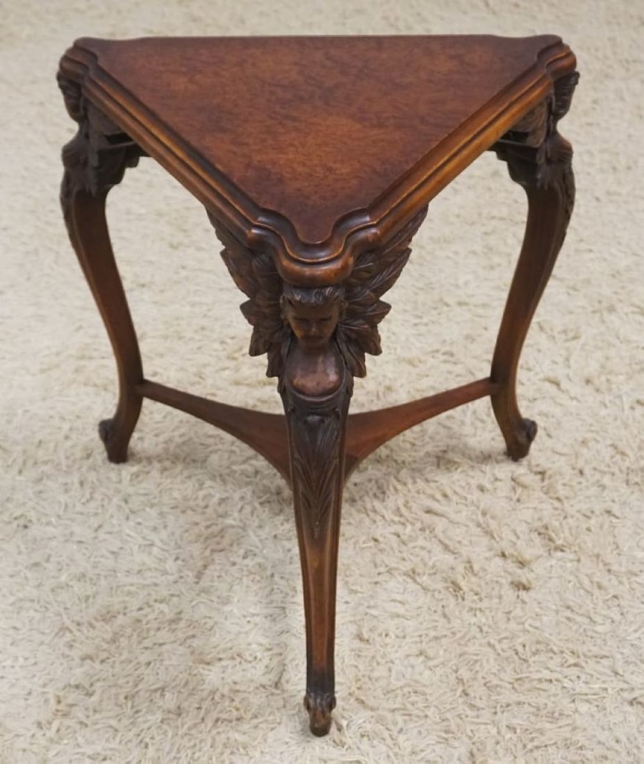 WALNUT TRIANGLE LAMP TABLE: WALUNT TRIANGLE LAMP TABLE WITH CARED WINGED BUST OF WOMEN AND BURL WOOD TOP, APPROXIMATELY 29 IN X 23 IN H