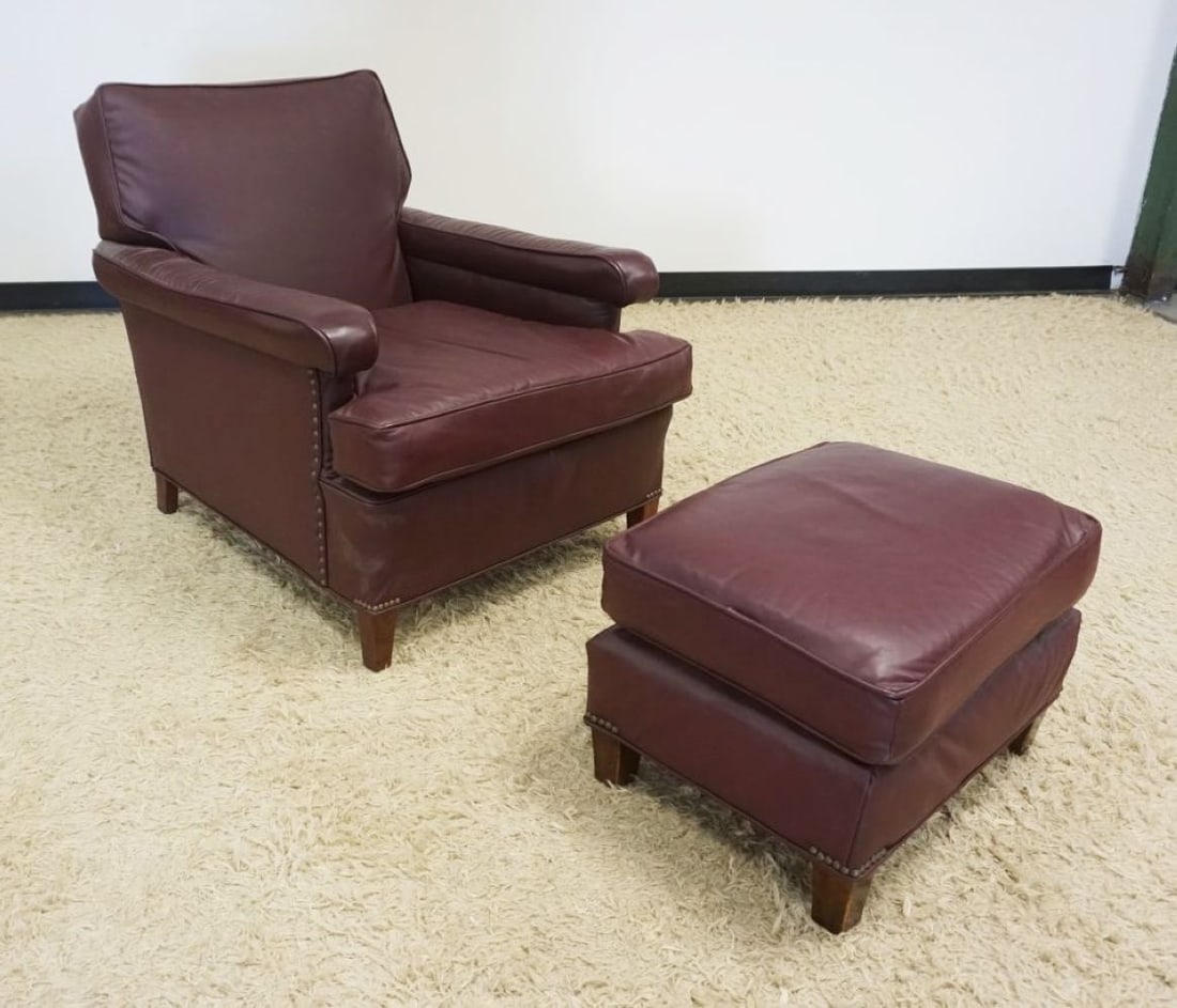 LEATHER ARM CHAIR AND FOOT STOOL: MAROON LEATHER ARM CHAIR WITH LEATHER FOOT STOOL
