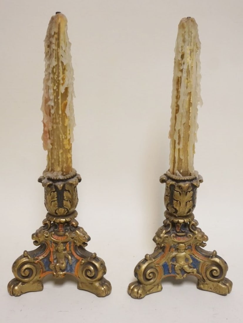 PR ORNATE EMBOSSED POLYCHROME CANDLESTICKS: PAIR OF ORNATE EMBOSSED COPPER SHEATHED POLYCHROME CANDLESTICKS WITH IMAGES OF LION HEADS AND CHERUBS, EACH APPROXIMATELY 8 IN H