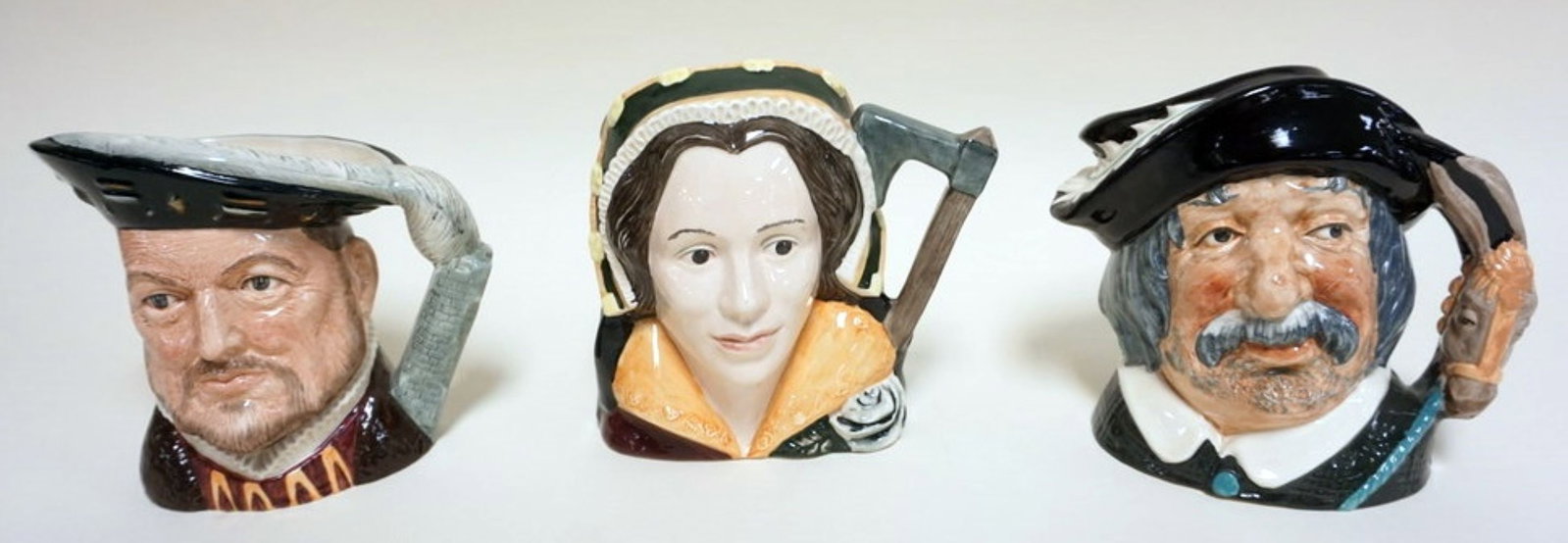 3 ROYAL DOULTON TOBIES: 3 ROYAL DOULTON TOBIES, SANCHO PANCA, CATHERINE HOWARD, HENRY VIII, TALLEST APPROXIMATELY 7 1/2 IN