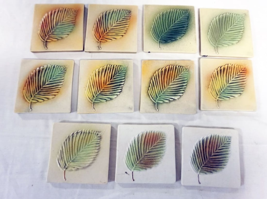 NATALIE SURVING ARCHITECTURAL TILES: NATALIE SURVING ARCHITECTURAL TILES, SURVING STUDIOS, LEAF TILES, EACH APPROXIMATELY 4 IN X 4 IN, 11 TILES