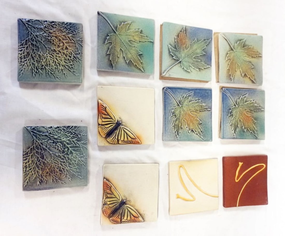 NATALIE SURVING ARCHITECTURAL TILES: NATALIE SURVING ARCHITECTURAL TILES, SURVING STUDIOS, ASSORTED LEAF, BRANCH AND BUTTERFLY TILES, EACH APPROXIMATELY 4 IN X 4 IN, 11 TILES