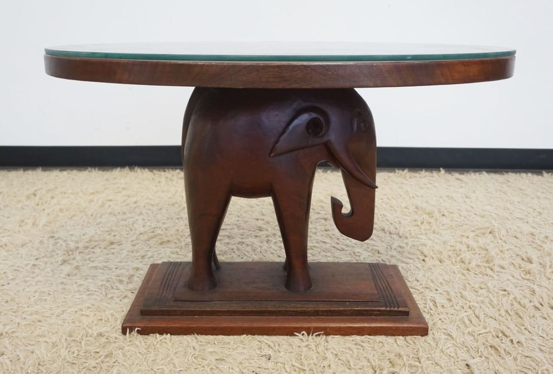 SOLID MAHOGANY OVAL ELEPHANT TABLE: SOLID MAHOGANY OVAL ELEPHANT TABLE WITH GLASS TOP, APPROXIMATELY 35 IN X 24 IN X 22 IN