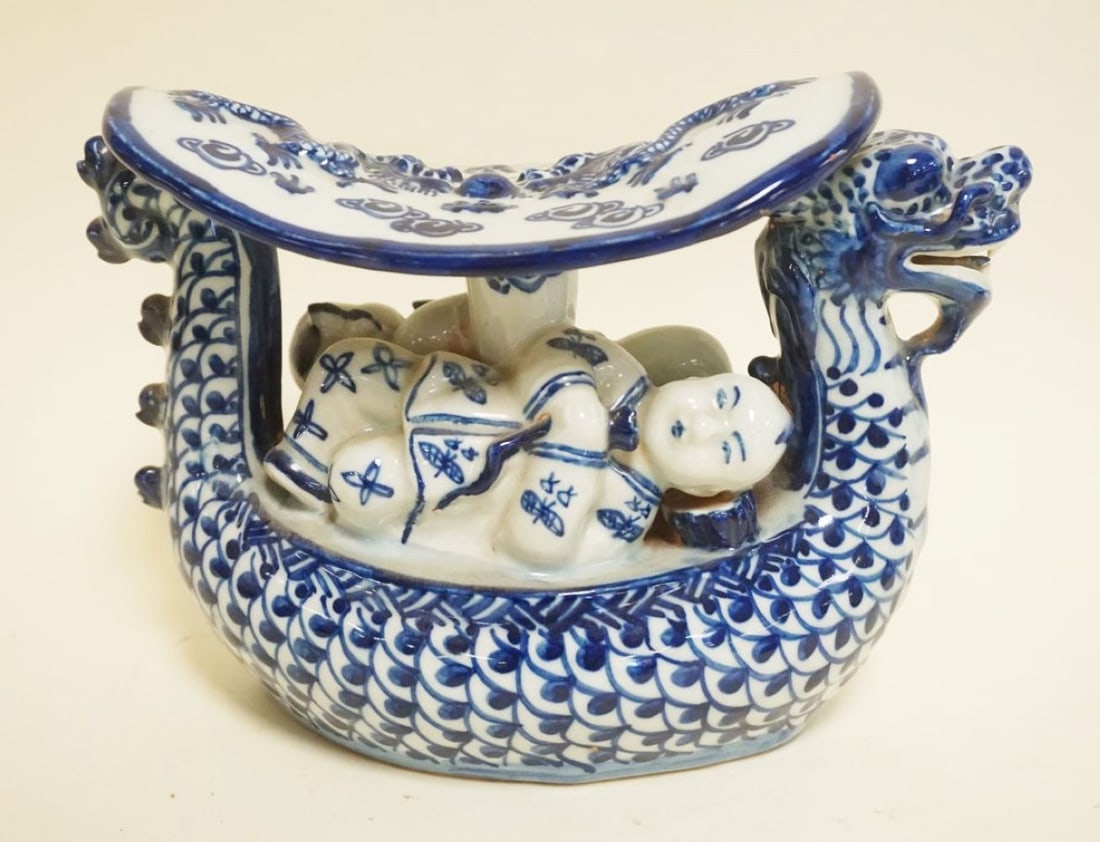 ASIAN BLUE & WHITE PORCELAIN DRAGON PILLOW: ASIAN BLUE & WHITE PORCELAIN DRAGON PILLOW, CHARACTER MARKS ON BASE, APPROXIMATELY 9 IN X 4 IN X 6 IN