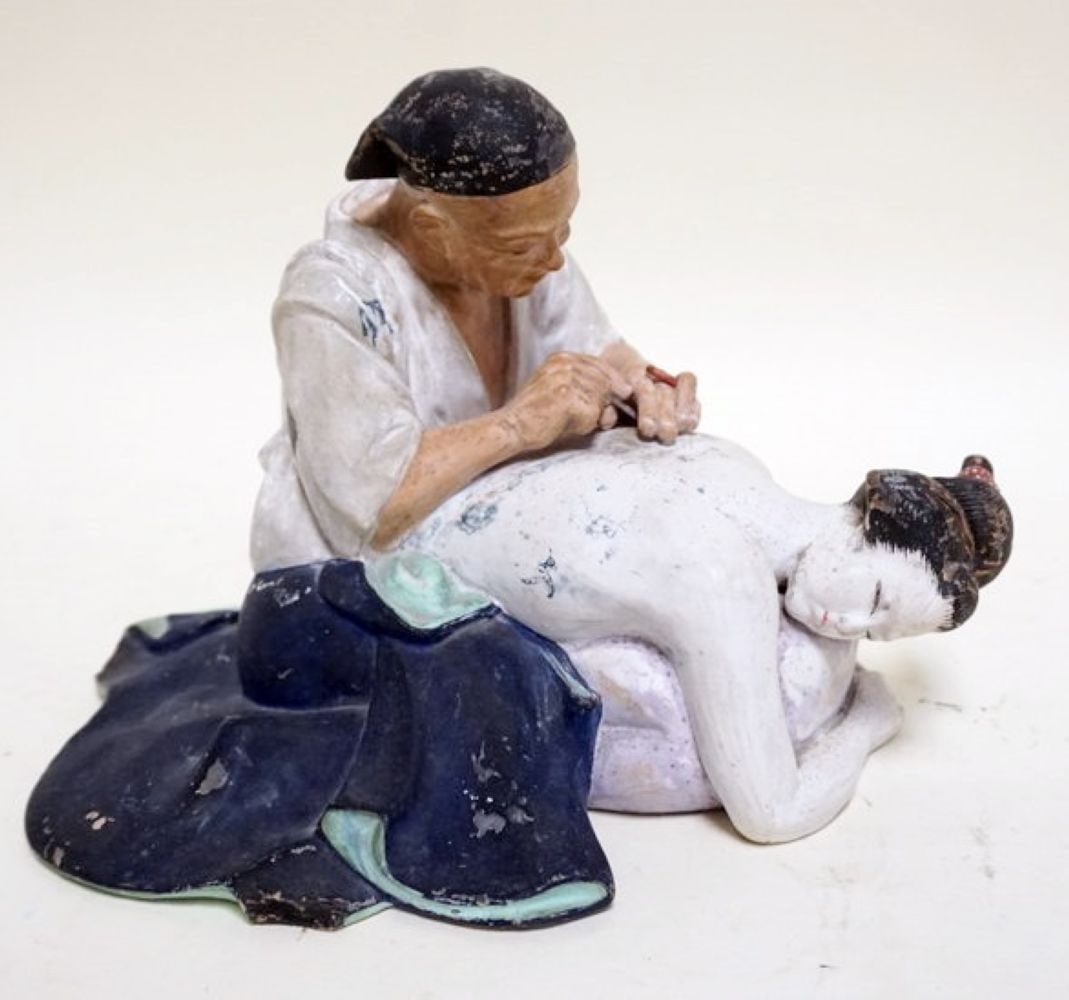 CHINESE TERRACOTTA STATUE OF MAN: CHINESE TERRACOTTA STATUE OF MAN GIVING ACCUPUNCTURE TO A WOMAN, BACK APPROXIMATELY 11 IN X 8 IN X 8 IN H