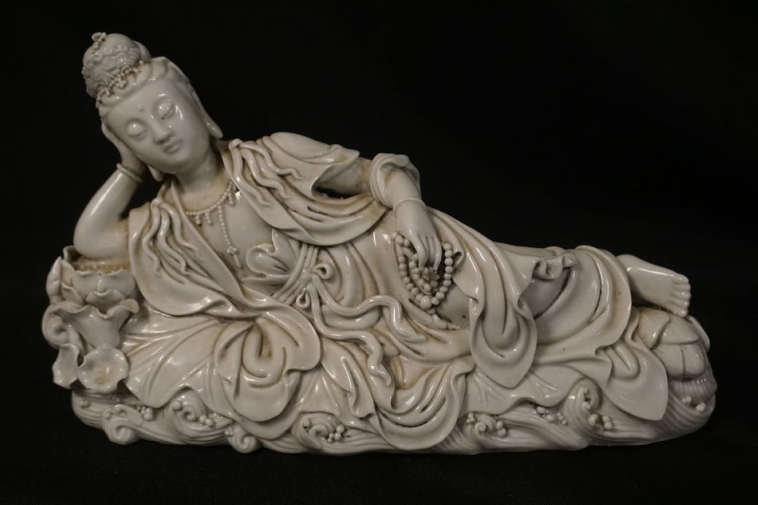 PORCELAIN FIGURE OF ASIAN WOMAN: PORCELAIN FIGURE OF ASIAN WOMAN RECLINING, APPROXIMATELY 3 IN X 12 IN X 7 IN HIGH