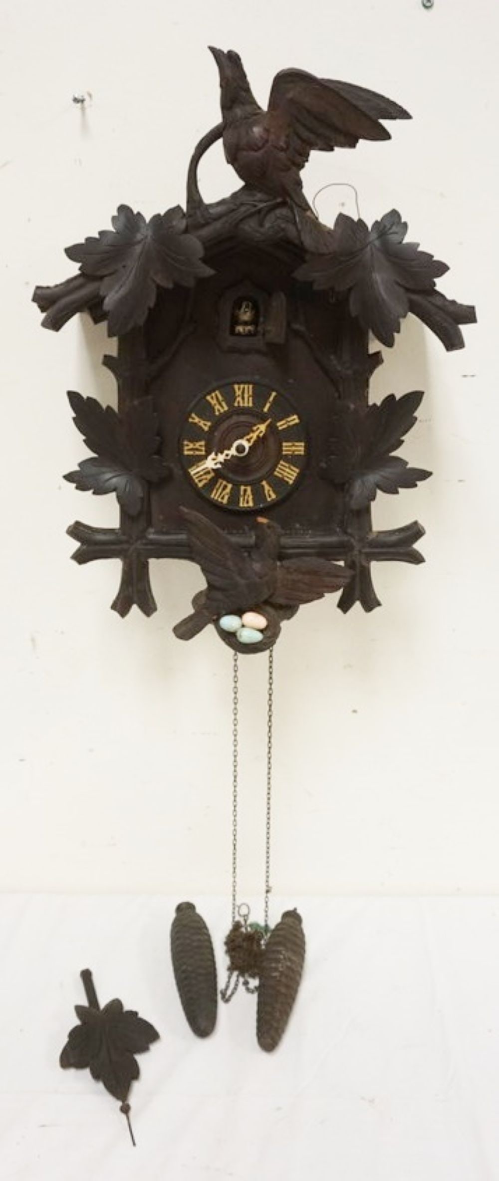 CARVED CUCKOO CLOCK: CARVED CUCKOO CLOCK, SOME LOSS TO CARVING, SOLD AS FOUND FOR RESTORATION, APPROXIMATELY 14 IN X 8 IN X 20 IN HIGH