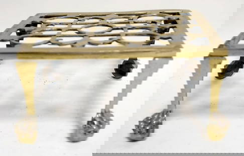 ANTIQUE BRASS CLAW FOOT TRIVIT: ANTIQUE BRASS CLAW FOOT TRIVIT, APPROXIMATELY 7 IN X 8 IN X 4 IN HIGH