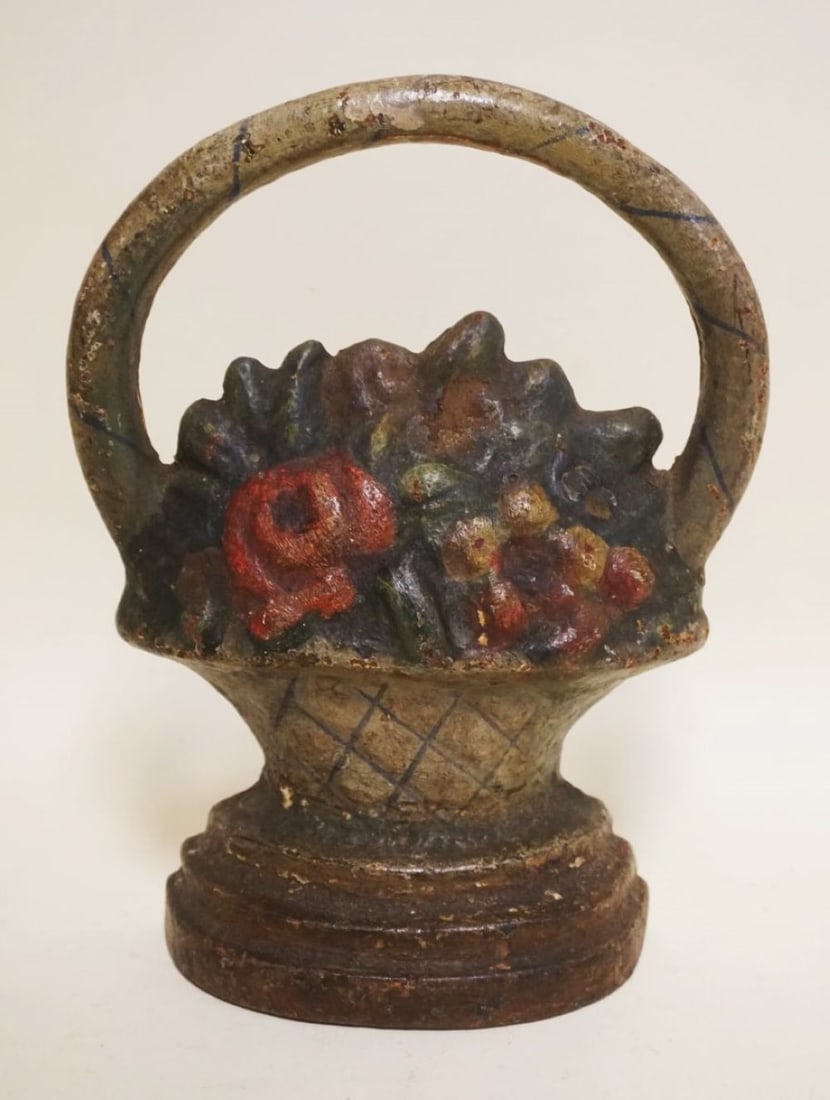 CAST IRON BASKET DOORSTOP: CAST IRON BASKET DOORSTOP, APPROXIMATELY 9 IN HIGH