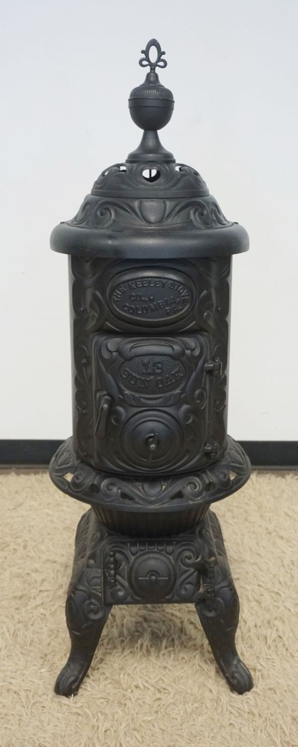 CAST IRON STOVE, THE KEELEY STOVE CO: CAST IRON STOVE, THE KEELEY STOVE CO., APPROXIMATELY 47 IN H