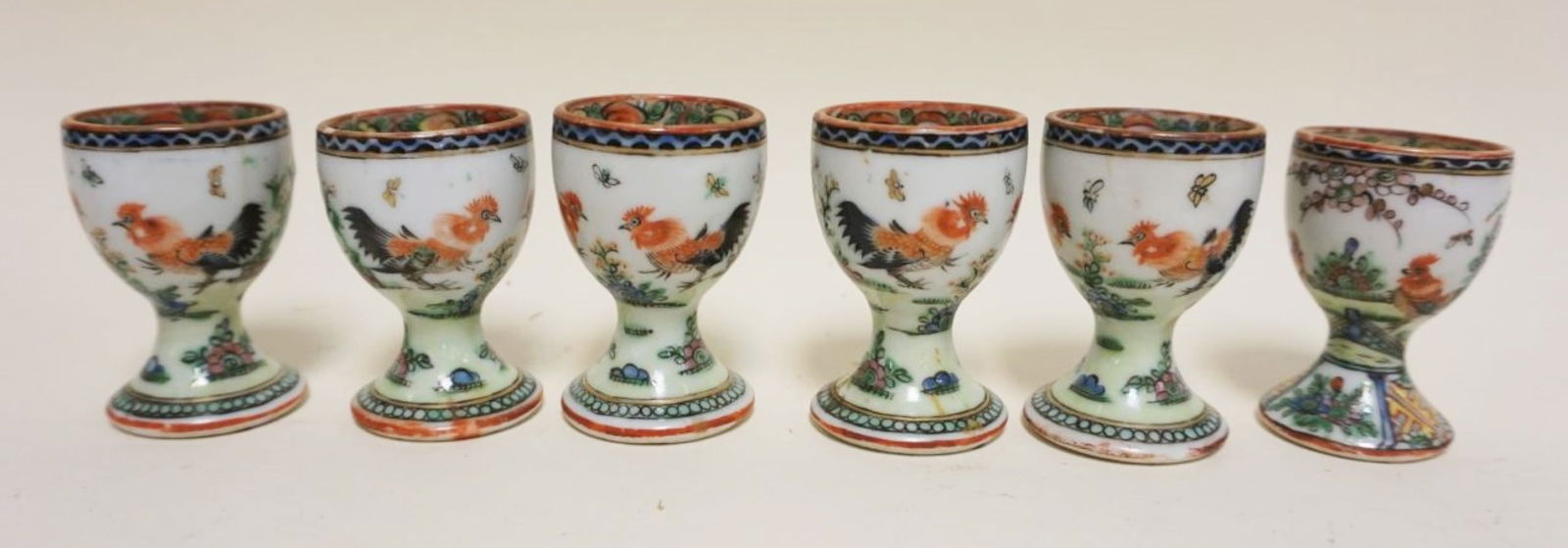 ASIAN PORCELAIN EGG CUPS: ASIAN PORCELAIN EGG CUPS W/IMAGES OF ROOSTERS, EACH APPROXIMATELY 3 IN HIGH