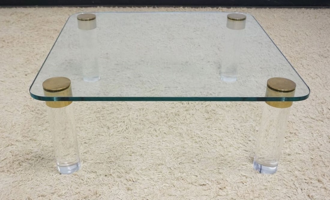 MID CENTURY MODERN GLASS COCKTAIL TABLE: MID CENTURY MODERN GLASS COCKTAIL TABLE WITH LUCITE COLUMN LEGS, APPROXIMATELY 42 IN SQ X 16 IN H