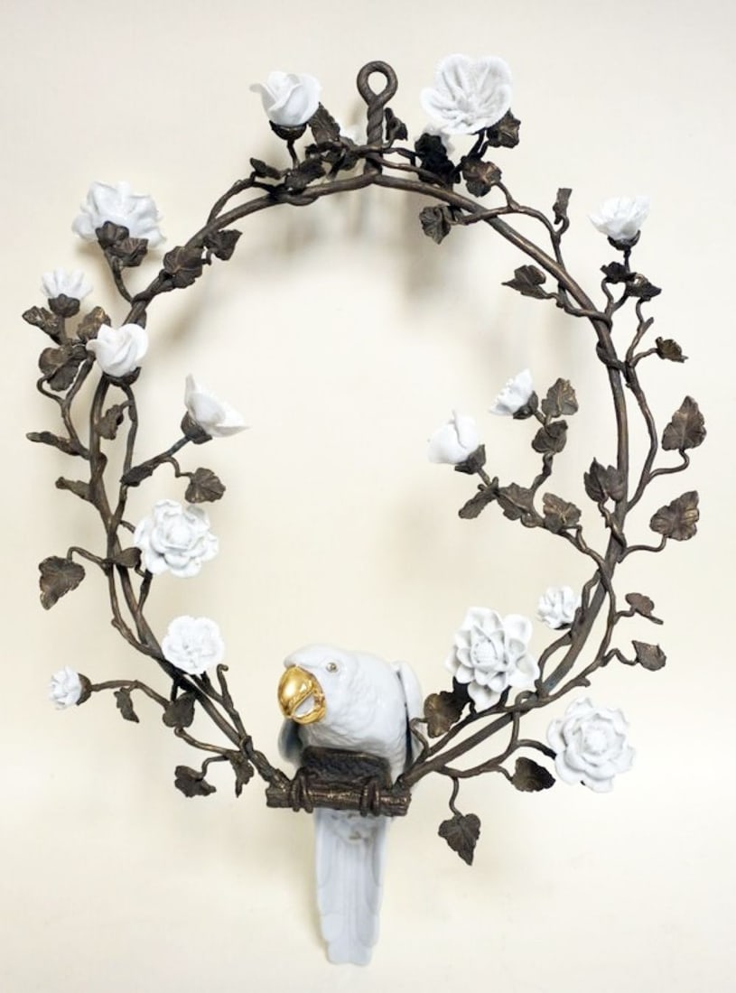 HANGING CERAMIC PARROT ON BRONZE WREATH: HANGING CERAMIC PARROT ON BRONZE WREATH WITH CERAMIC FLOWERS ON BOTH SIDES, APPROXIMATELY 18 IN X 22 IN H