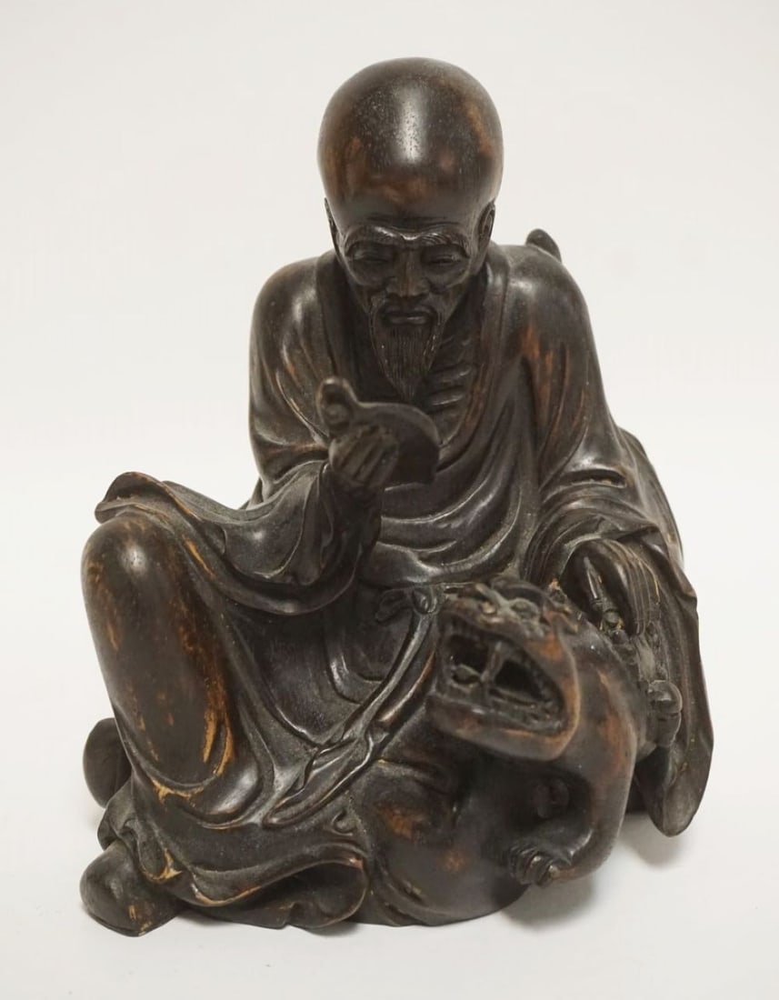 ASIAN WOOD CARVING OF A MAN READING: ASIAN WOOD CARVING OF A MAN READING & PETTING A TIGER, APPROXIMATELY 8 IN HIGH