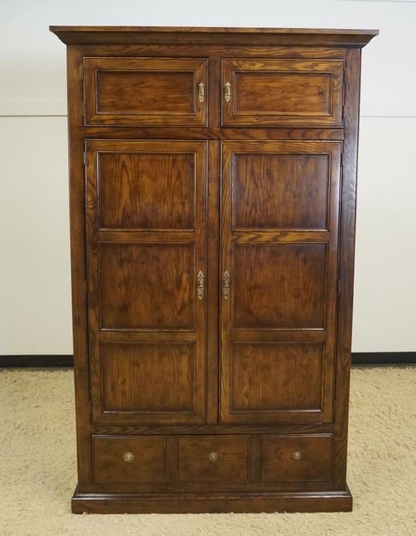HENREDON TALL OAK WARDROB LINEN PRESS: HENREDON TALL OAK WARDROBE LINEN PRESS HAVING 4 DOORS, 3 INTERIOR DRAWERS OVER 1 LOWER DRAWER, APPROXIMATELY 50 IN X 20 IN X 81 IN H, 3 DRAWER PULLS MISSING ON OAK