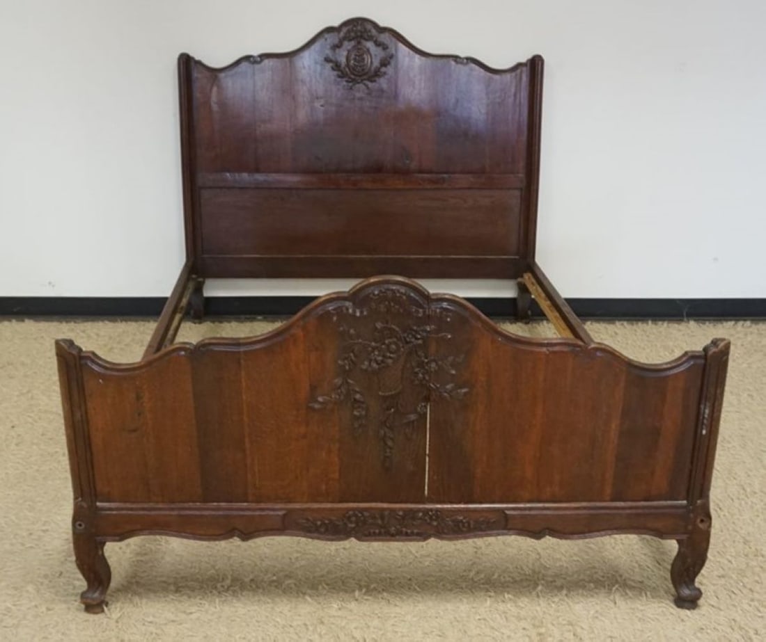 ANTIQUE FRENCH OAK CARVED BED: ANTIQUE FRENCH OAK CARVED BED WITH FLOWER BASKET CARVING, APPROXIMATELY 56 IN X 80 IN X 51 IN H