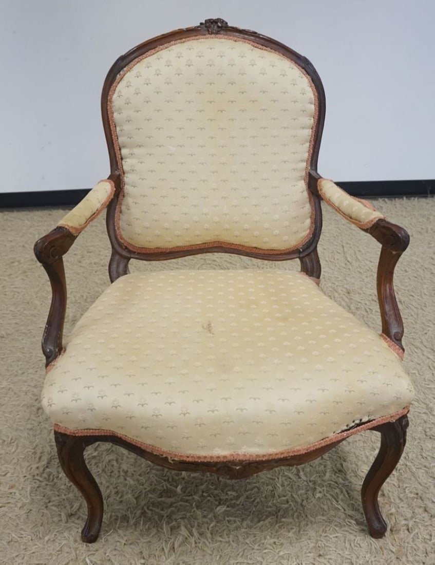 ANTIQUE FRENCH PROVINCAL UPHOLSTERED CHAIR: ANTIQUE FRENCH PROVINCAL UPHOLSTERED AND CARVED ARM CHAIR