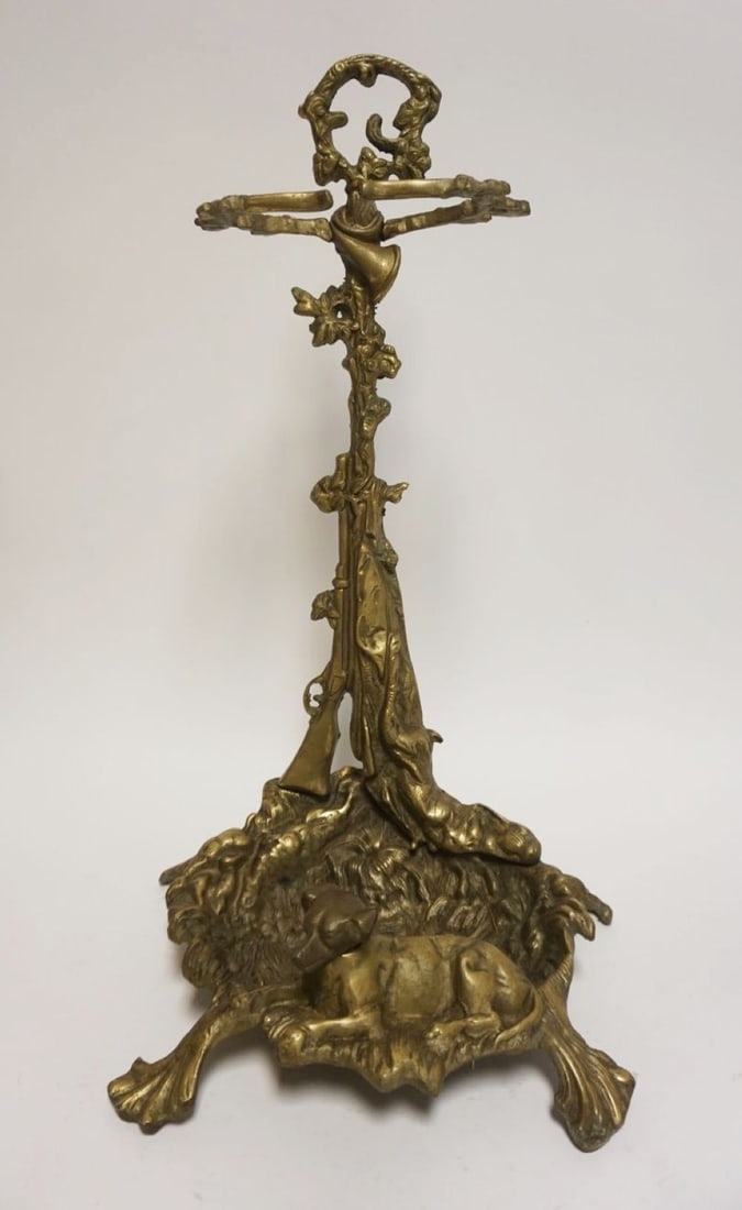HEAVY ORNATE CAST BRASS FIREPLACE TOOL HOLDER: HEAVY ORNATE CAST BRASS FIREPLACE TOOL HOLDER OR UMBRELLA STAND W/EMBOSSED IMAGES OF DOG & FIREARM, APPROXIMATELY 23 IN HIGH