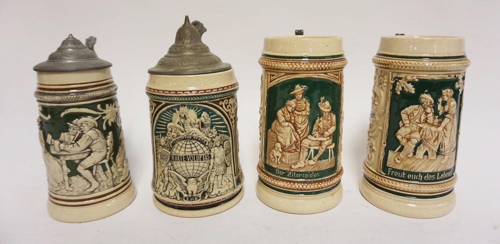 GROUP OF 4 VINTAGE GERMAN STEINS: GROUP OF 4 VINTAGE GERMAN STEINS, 2 MISSING PEWTER TOPS, TALLEST APPROXIMATELY 7 IN