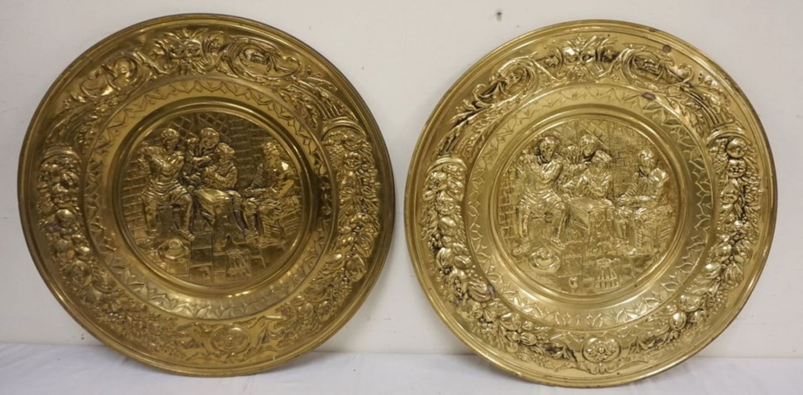 PAIR OF LARGE BRASS WALL CHARGERS (1 of 2)