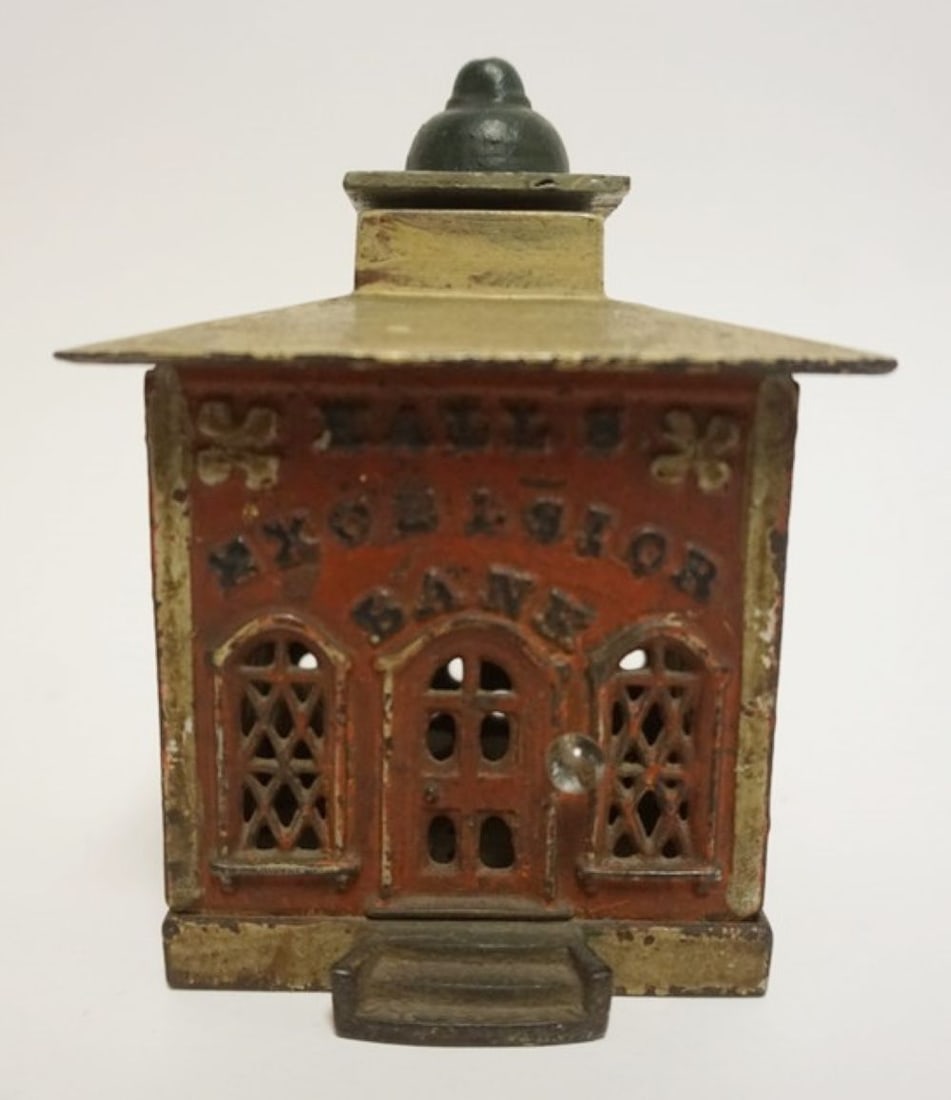 ANTIQUE MECHANICAL CAST IRON BANK: ANTIUE MECHANICAL CAST IRON BANK, *HALLS EXCELSIOR BANK*, APPROXIMATELY 4 IN SQ X 5 1/2 IN H