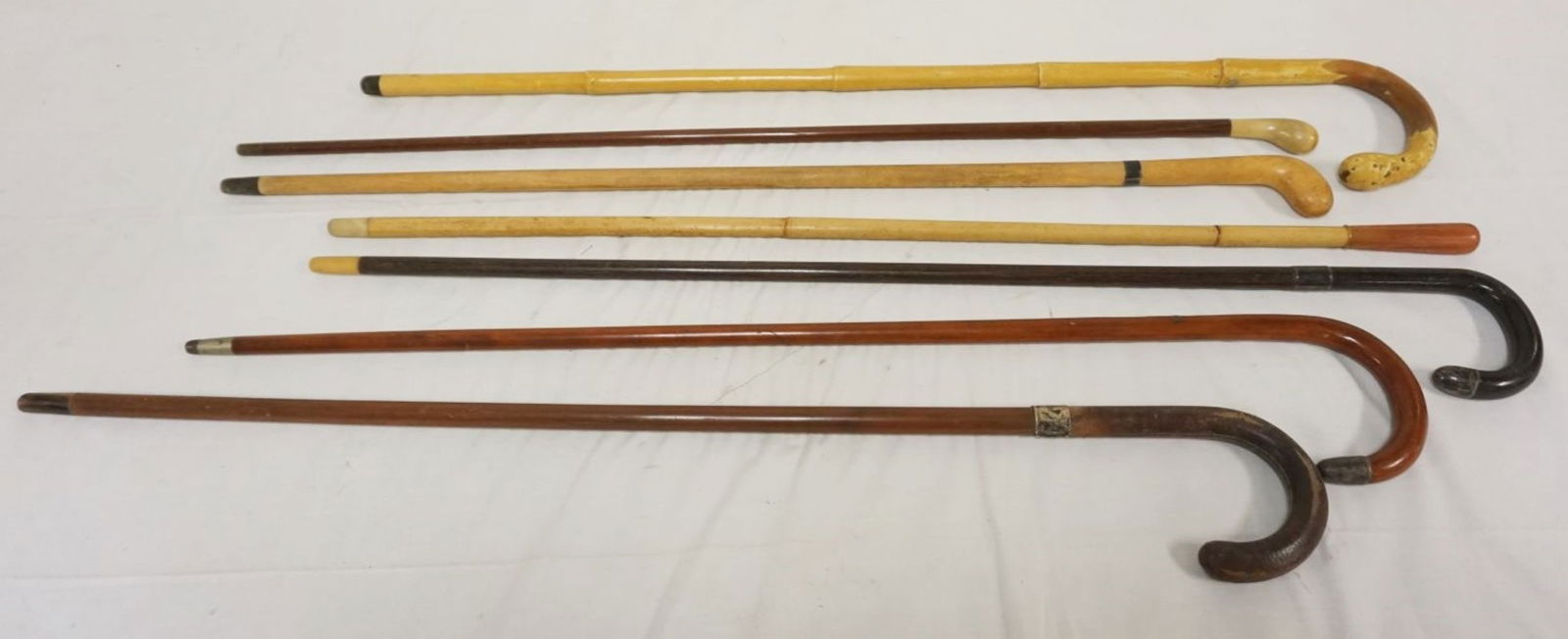 COLLECTION OF CANES & WALKING STICKS: COLLECTION OF CANES & WALKING STICKS MANY W/SILVER BANDS