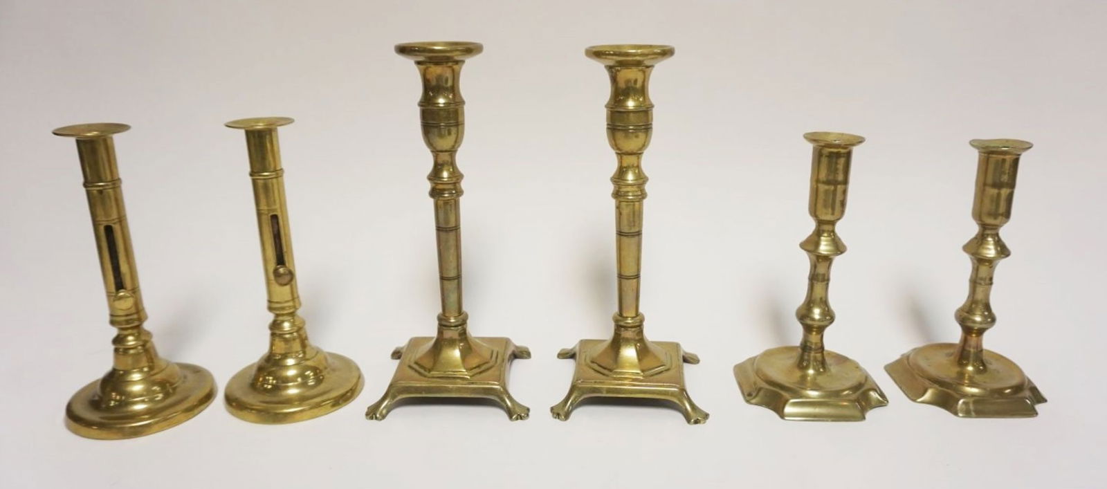 GROUP OF ANTIQUE BRASS CANDLESTICKS (1 of 6)