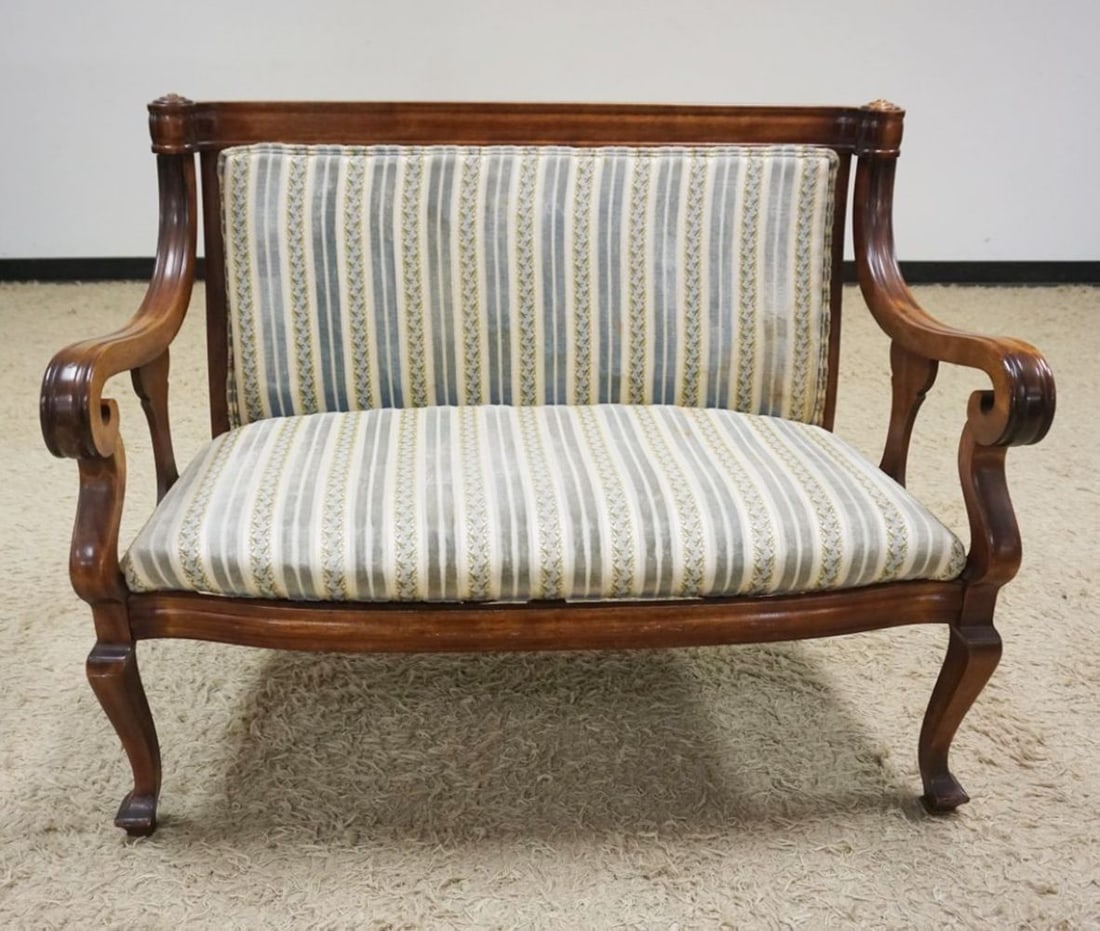 MAHOGANY UPHOLSTERED EMPIRE STYLE LOVE SEAT: MAHOGANY UPHOLSTERED EMPIRE STYLE SCROLLED ARM LOVE SEAT, APPROXIMATELY 45 IN X 24 IN X 36 IN H, SOME STAINING ON UPHOLSTERY