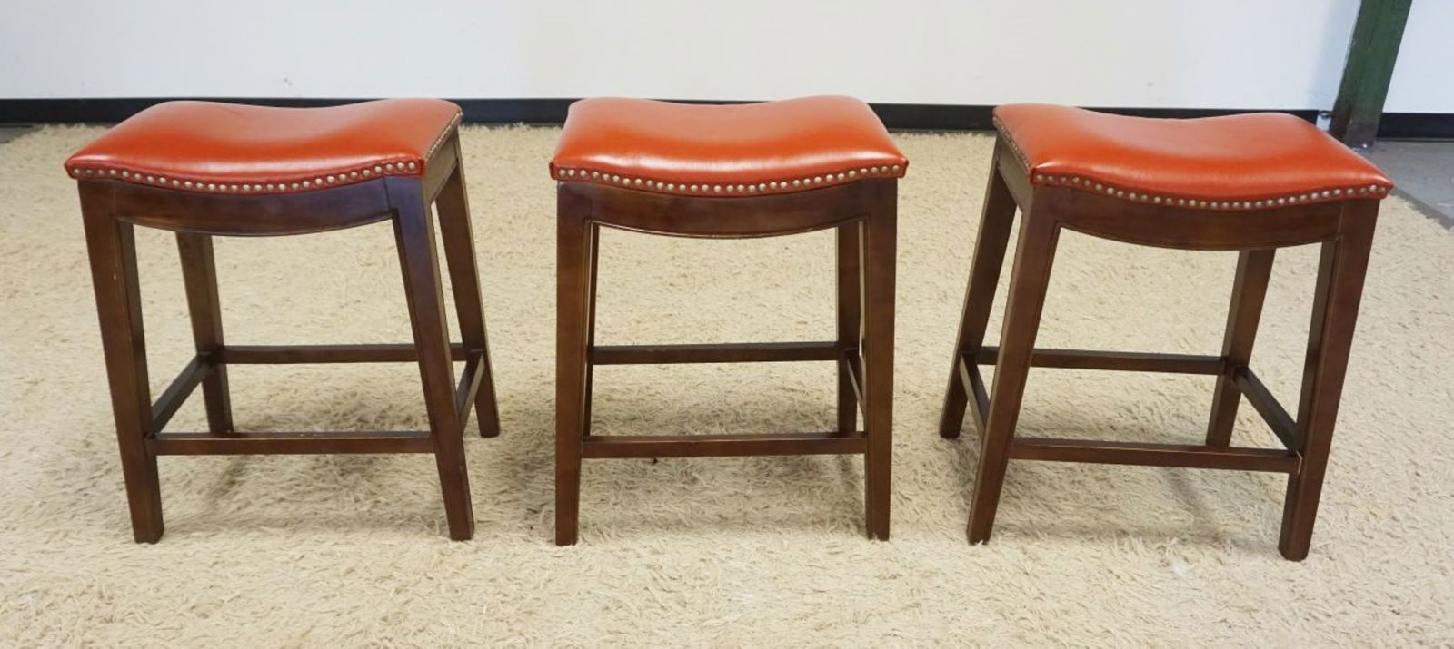 SADDLE SHAPED STOOLS (1 of 4)