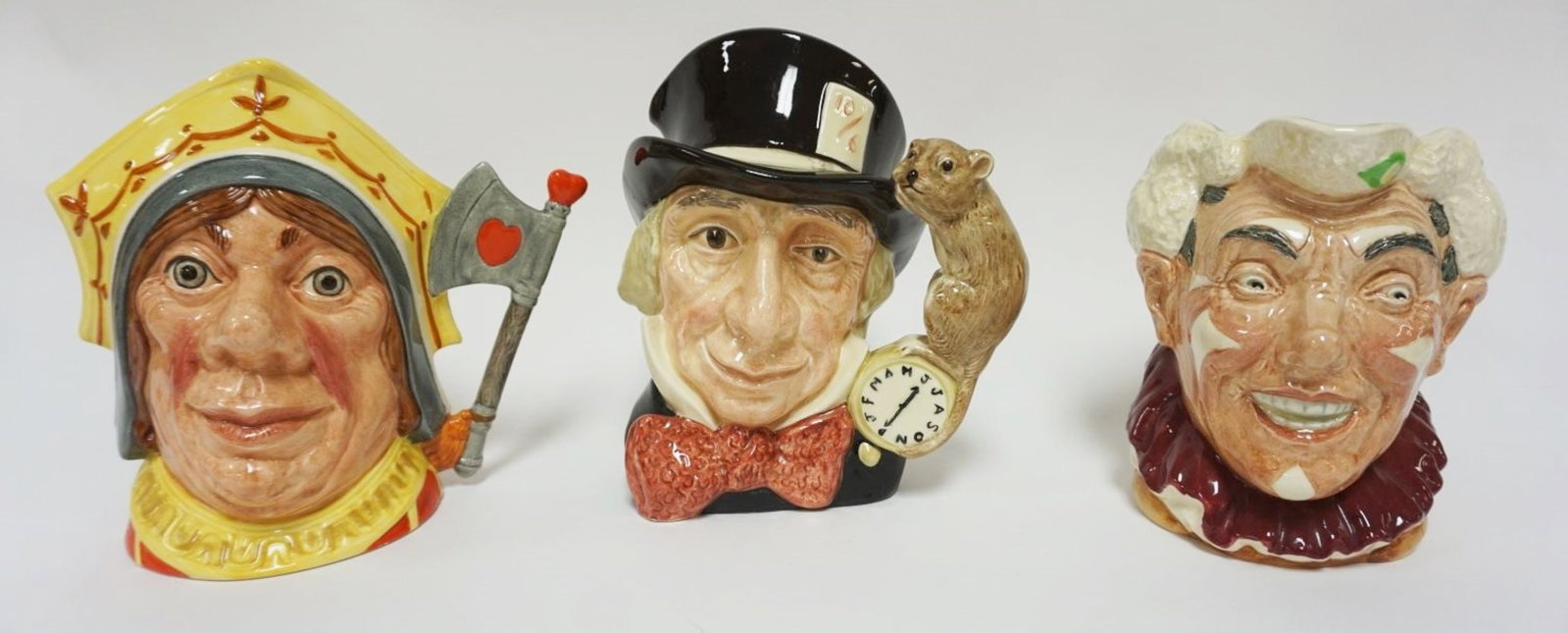 ROYAL DOULTON CHARACTER TOBY JUGS: ROYAL DOULTON CHARACTER TOBY JUGS, THE RED QUEEN, MAD HATTER, THE CLOWN, EACH APPROXIMATELY 8 1/4 IN HIGH