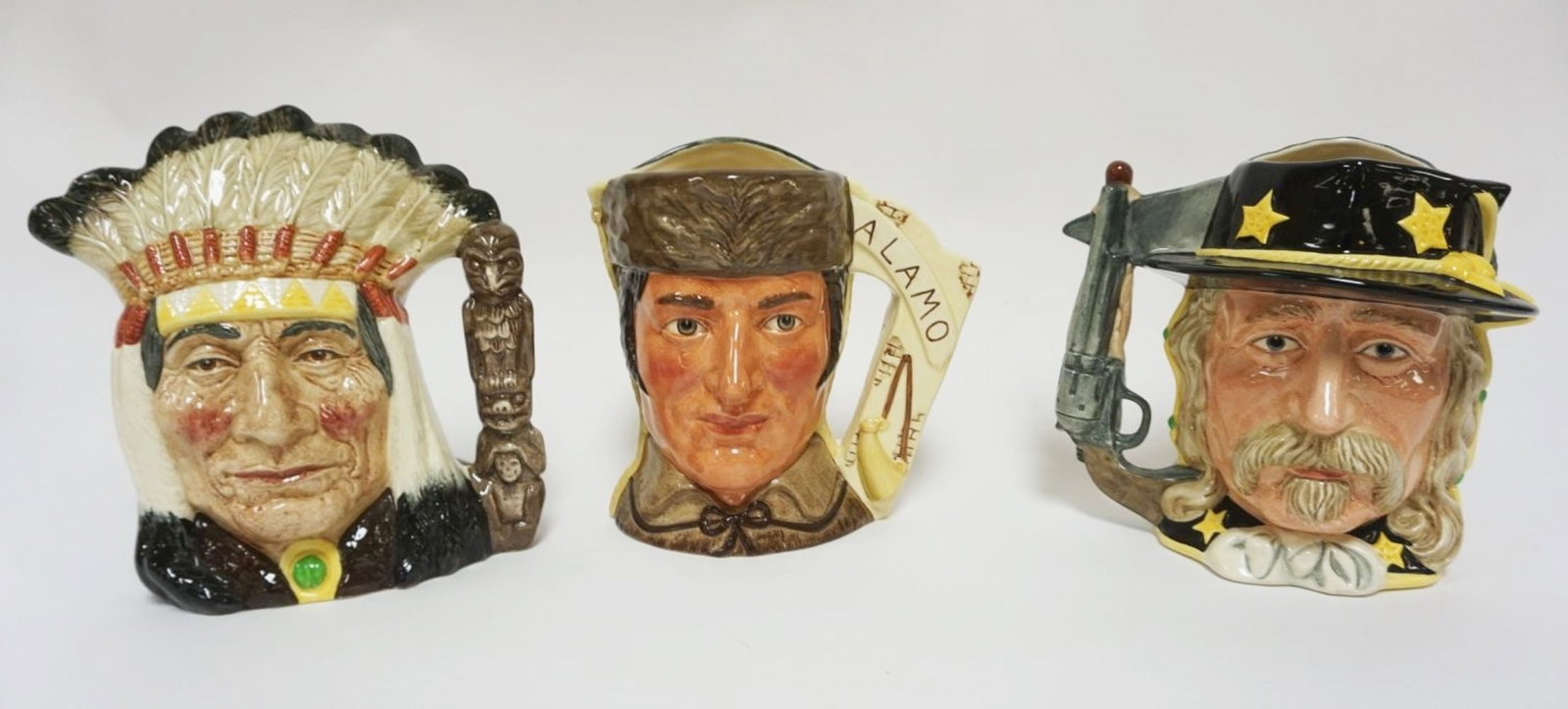 ROYAL DOULTON CHARACTER TOBY JUGS: ROYAL DOULTON CHARACTER TOBY JUGS, THE ANTAGONIST COLLECTION, BATTLE OF LITTLE BIG HORN, BATTLE OF THE ALAMO & NORTH AMERICAN INDIAN, EACH APPROXIMATELY 8 IN HIGH