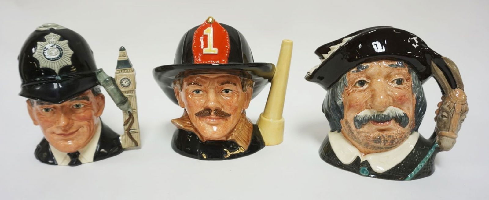 ROYAL DOULTON CHARACTER TOBY JUGS: ROYAL DOULTON CHARACTER TOBY JUGS, THE LONDON BOBBY, THE FIREMAN, SANCHO PONCHO, EACH APPROXIMATELY 8 IN HIGH