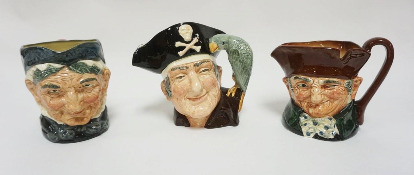 ROYAL DOULTON CHARACTER TOBY JUGS: ROYAL DOULTON CHARACTER TOBY JUGS, GRANNY, OLD CHARLEY, LONG JOHN SILVER, EACH APPROXIMATELY 8 IN HIGH