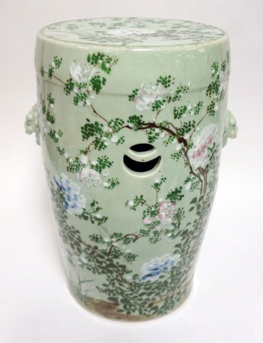 ASIAN GREEN CELADON PORCELAIN GARDEN STOOL: ASIAN GREEN CELADON PORCELAIN GARDEN STOOL WITH EMBOSSED FOO DOG HEADS, APPROXIMATELY 12 IN X 20 IN H
