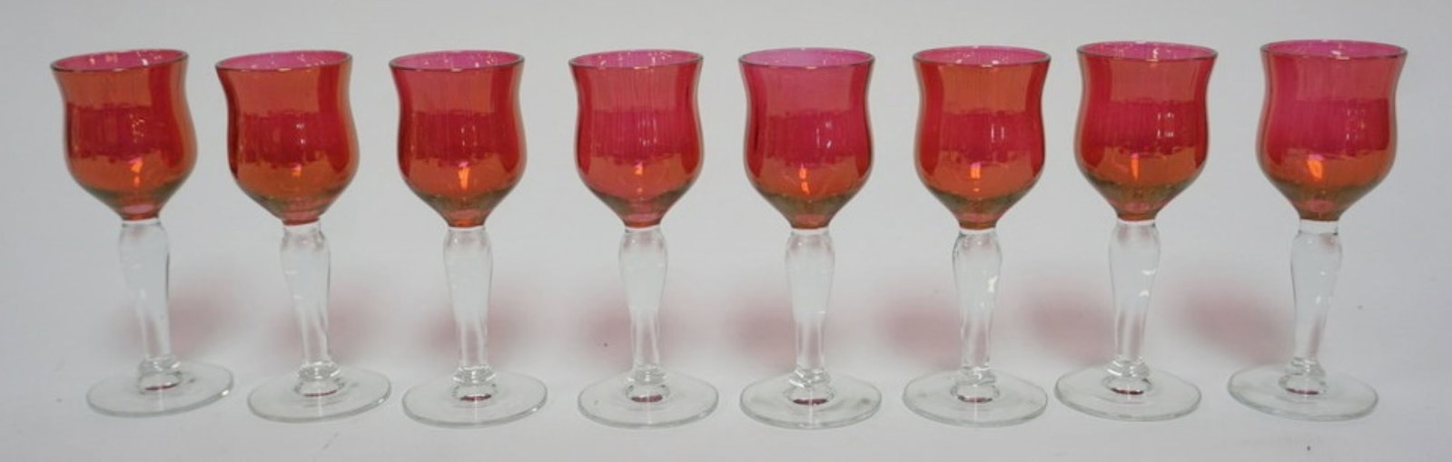 CRANBERRY GLASS CORDIALS: SET OF 8 CRANBERRY GLASS CORDIALS, EACH APPROXIMATELY 4 IN H