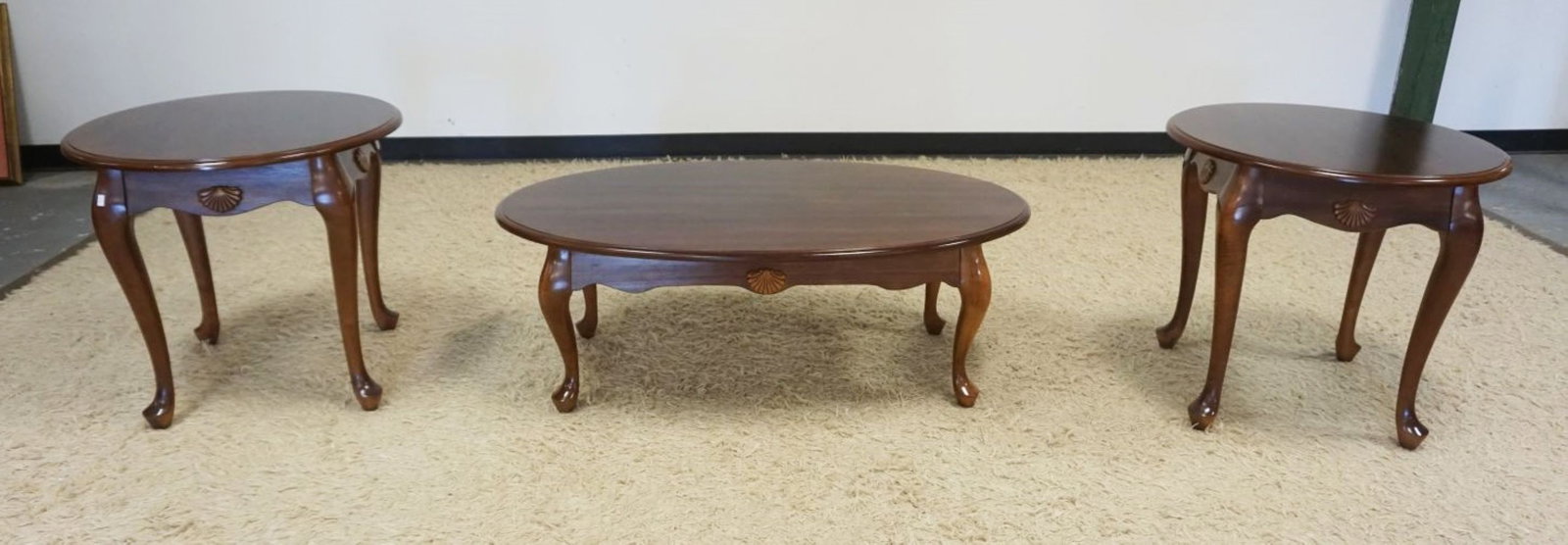 3 PIECE COFFEE TABLE SET: 3 PIECE LAMP AND COFFEE TABLE SET IN CHERRY WOOD FINISH AND APPLIED SHELL CARVINGS, LAMP TABLES APPROXIMATELY 25 IN X 23 IN H, COFFEE TABLE APPROXIMATELY 45 IN X 27 IN X 16 IN H