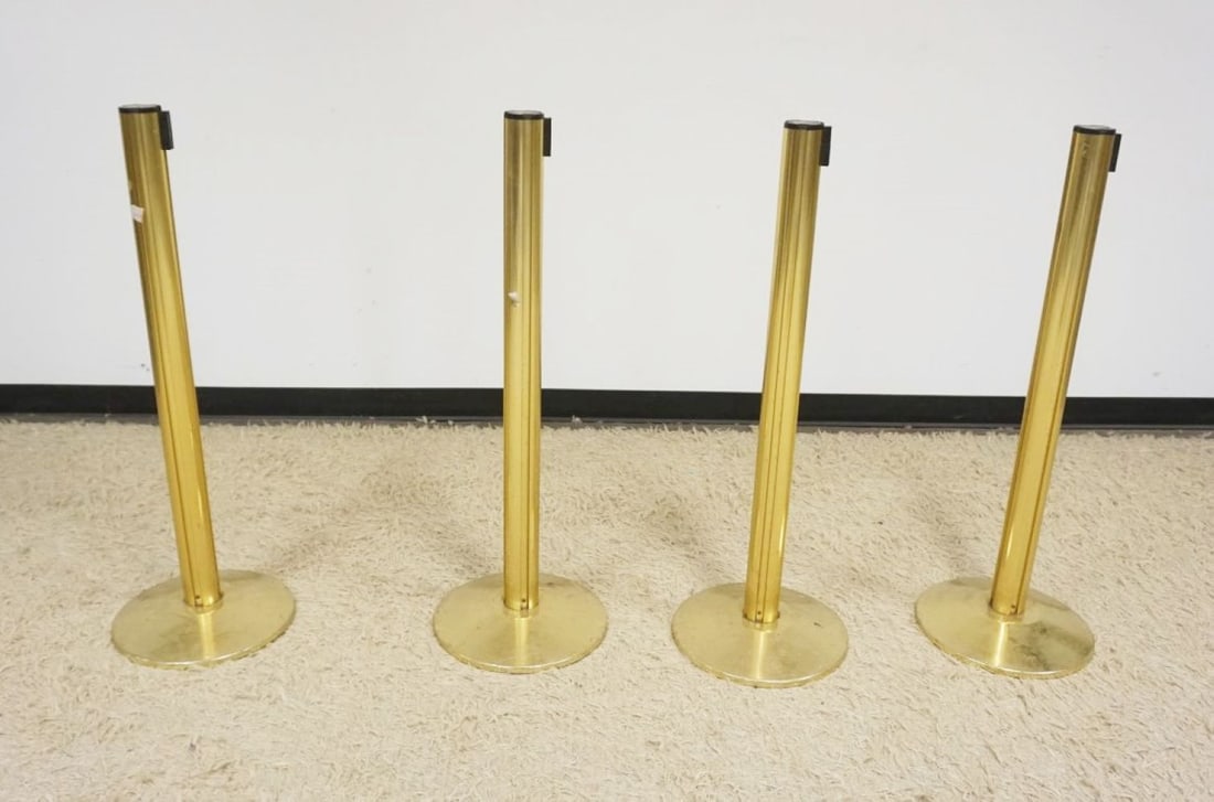 4 BRASS SHEATHED STANCHIONS: GROUP OF 4 BRASS SHEATHED STANCHIONS, EACH APPROXIMATELY 41 IN H X 14 IN ROUND BASE