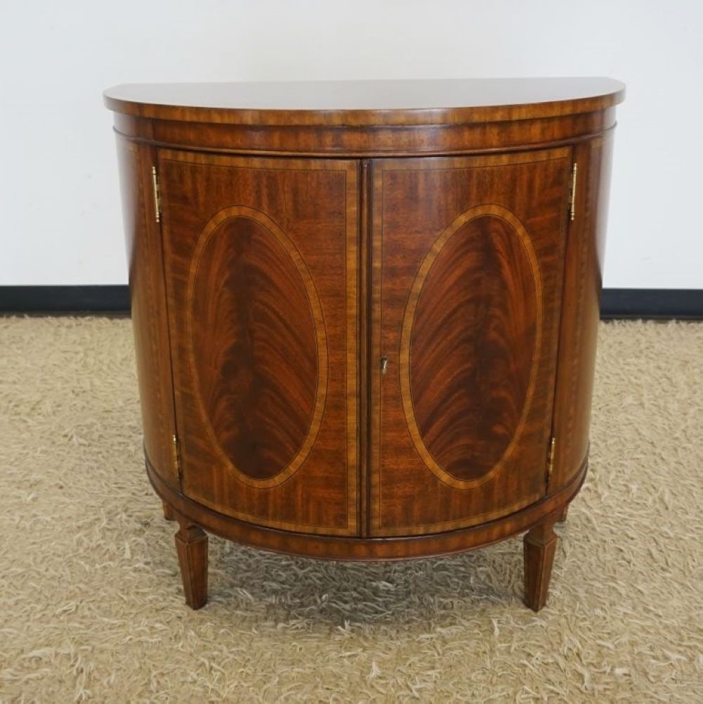 MAITLAND SMITH DEMI LUNE CABINET: MAITLAND SMITH MAHOGANY DEMI LUNE 2 DOOR CABINET WITH OVAL MEDALLION INLAY AND BANDED TRIM, APPROXIMATELY 32 IN X 19 IN X 32 IN H