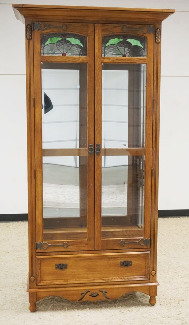 PULASKI OAK CRYSTAL CABINET: PULASKI OAK 2 DOOR CRYSTAL CABINET WITH LOWER DRAWER AND BEVELED GLASS DOORS WITH SLAG AND ICED GLASS TOP, ADJUSTABLE SHELVES WITH INTERIOR LIGHTS, APPROXIMATELY 42 IN X 17 IN X 84 IN H