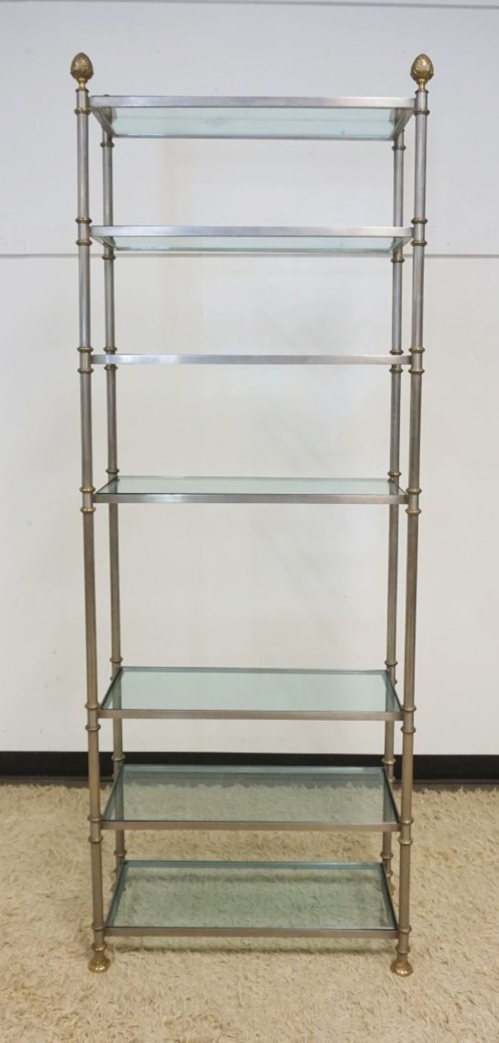 METAL FRAME SHELF: METAL FRAME SHELF WITH INSET GLASS SHELVES, BRASS FEET AND ACORN TOP, APPROXIMATELY 31 IN W X 14 IN D X 83 IN H