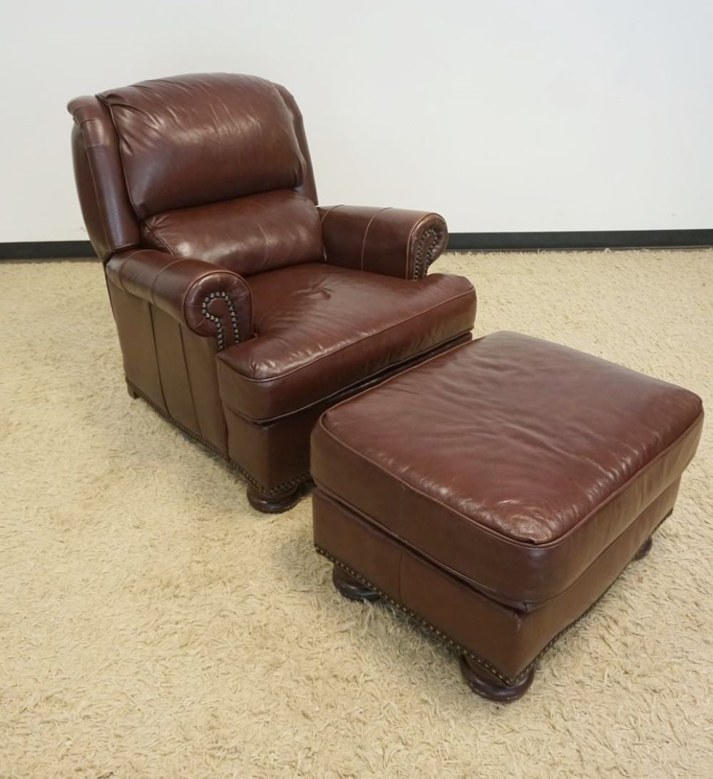 BRADINGTON YOUNG LEATHER CHAIR: BRADINGTON YOUNG LEATHER RECLINING CHAIR AND OTTOMAN, EACH HAVING BRASS TACK ACCENTS, CHAIR APPROXIMATELY 36 IN X 37 IN X 40 IN H, OTTOMAN APPROXIMATELY 39 IN X 23 IN X 17 IN H