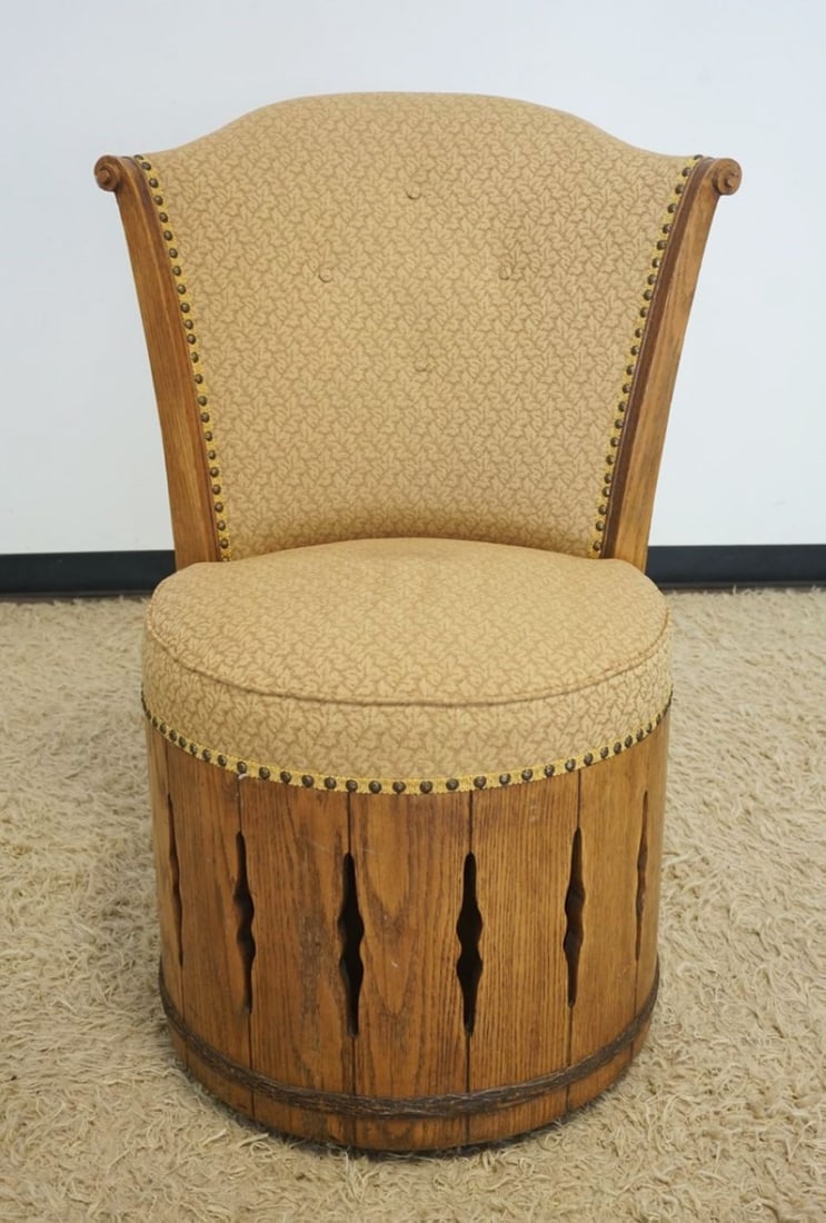 RANCH OAK REVOLVING BARREL CHAIR: RANCH OAK REVOLVING UPHOLSTERED BARREL CHAIR WITH BRASS TACKING ACCENTS, APPROXIMATELY 28 IN X 23 IN X 40 IN H