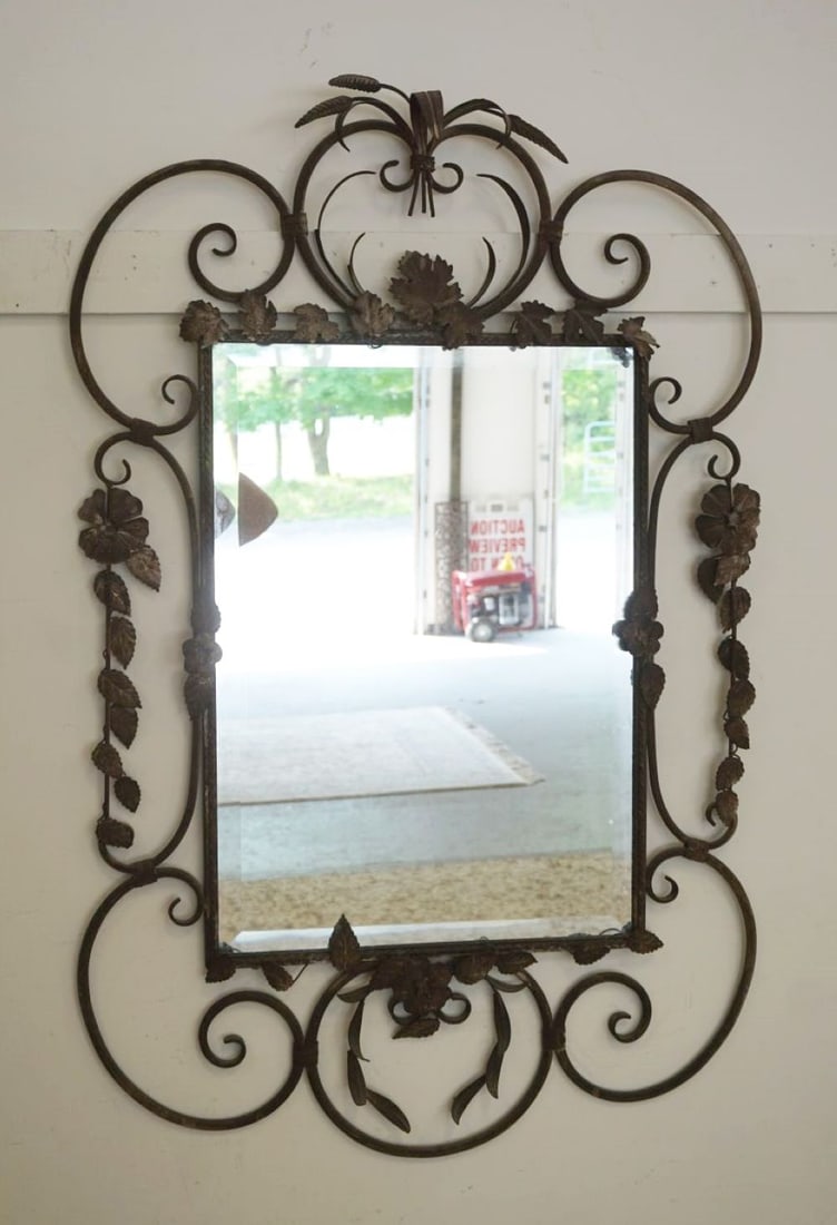 BEVELED GLASS HANGING MIRROR: BEVELED GLASS HANGING MIRROR IN FANCY WROUGHT IRON FRAME, APPROXIMATELY 31 IN X 47 IN