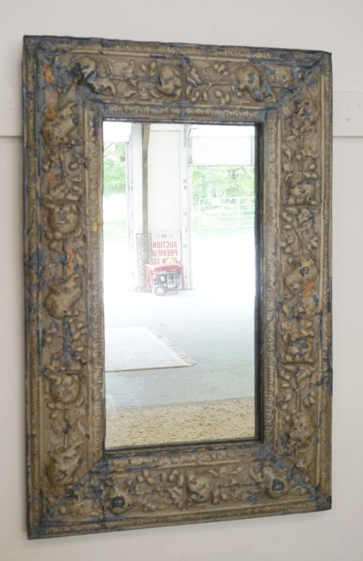 HANGING MIRROR IN EMBOSSED METAL FRAME: HANGING MIRROR IN EMBOSSED METAL FRAME, APPROXIMATELY 23 IN X 36 IN