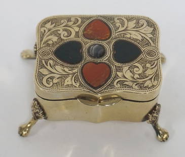 ANTIQUE ORNATE FOOTED TRINKET BOX: ANTIQUE ORNATE FOOTED TRINKET BOX W/INSET STONE & TOOLED ORNAMENT TOP, APPROXIMATELY 3 IN X 2 IN X 1 1/2 IN HIGH