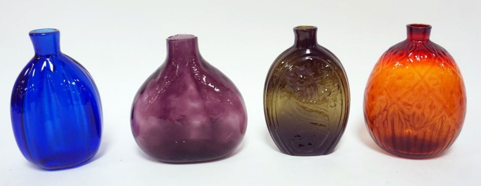 ASSORTED COLORED BLOWN GLASS FLASKS: GROUP OF ASSORTED COLORED BLOWN GLASS FLASKS, LARGEST APPROXIMATELY 6 IN