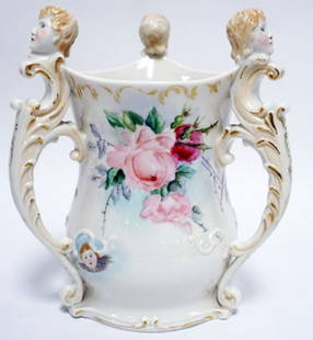 BELLEEK LENOX LOVING CUP: LENOX BELLEEK HAND PAINTED LOVING CUP, 3 HANDLED WITH FIGURAL HEADS, APPROXIMATELY 8 1/2 IN H